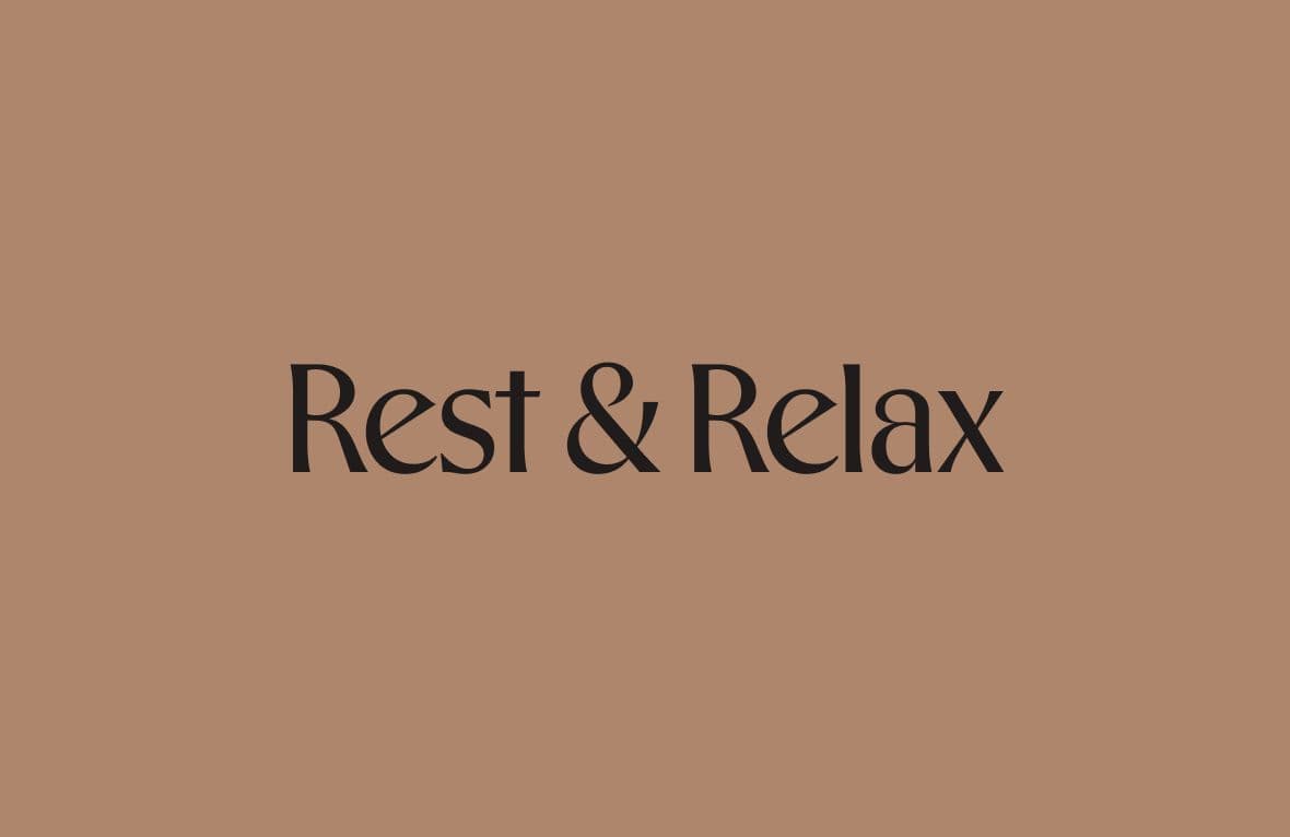 An image with the text “Rest & Relax” on a warm, muted background.